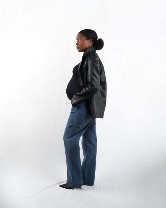 Model wearing The Joleen wide-leg maternity jeans in a modern streetwear outfit, demonstrating a stylish and edgy look for pregnant women.